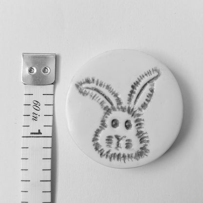 The needle minder measures three centimetres across or one and a quarter inches.