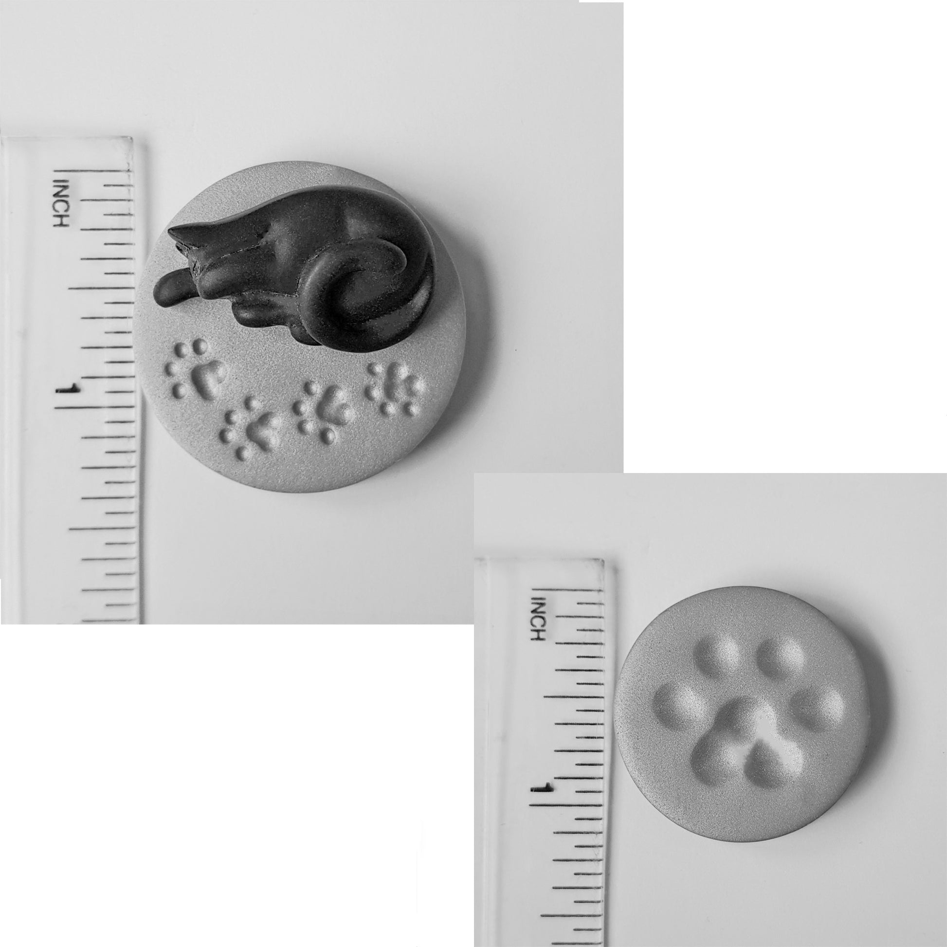 The black cat needle minder is 3.5 centimetres across or just under 1.5 inches. The smaller paw print needle minder measures 2.9 centimetres across or just over an inch.