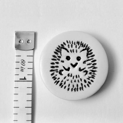 The needle minder measures three centimetres across or one and a quarter inches.