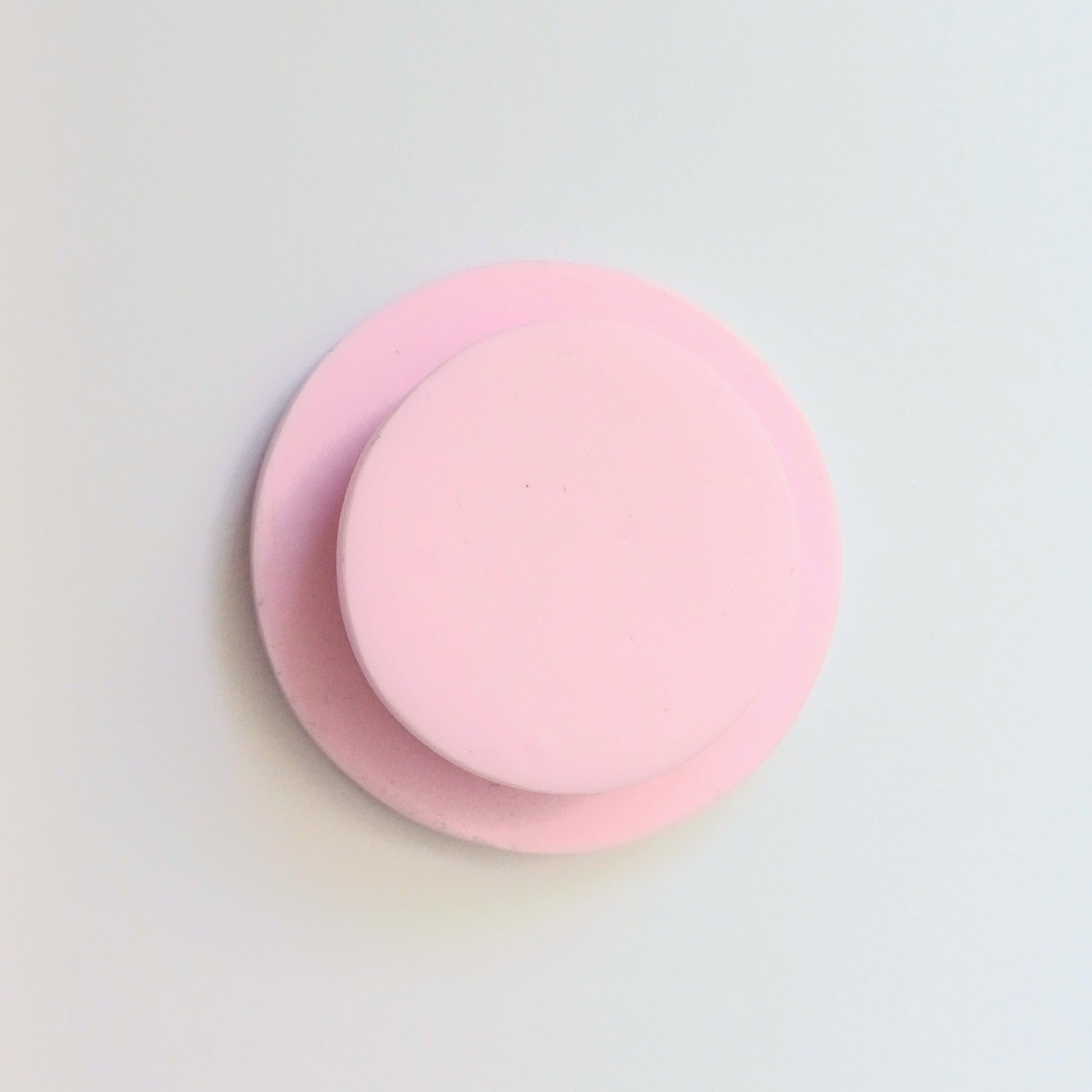 Back view of needle minder showing the plain, smooth disk