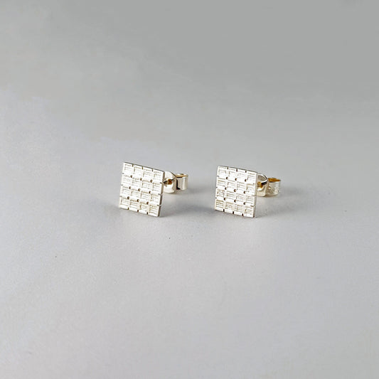 Square stud earrings with cross stitch aida fabric texture in sterling silver